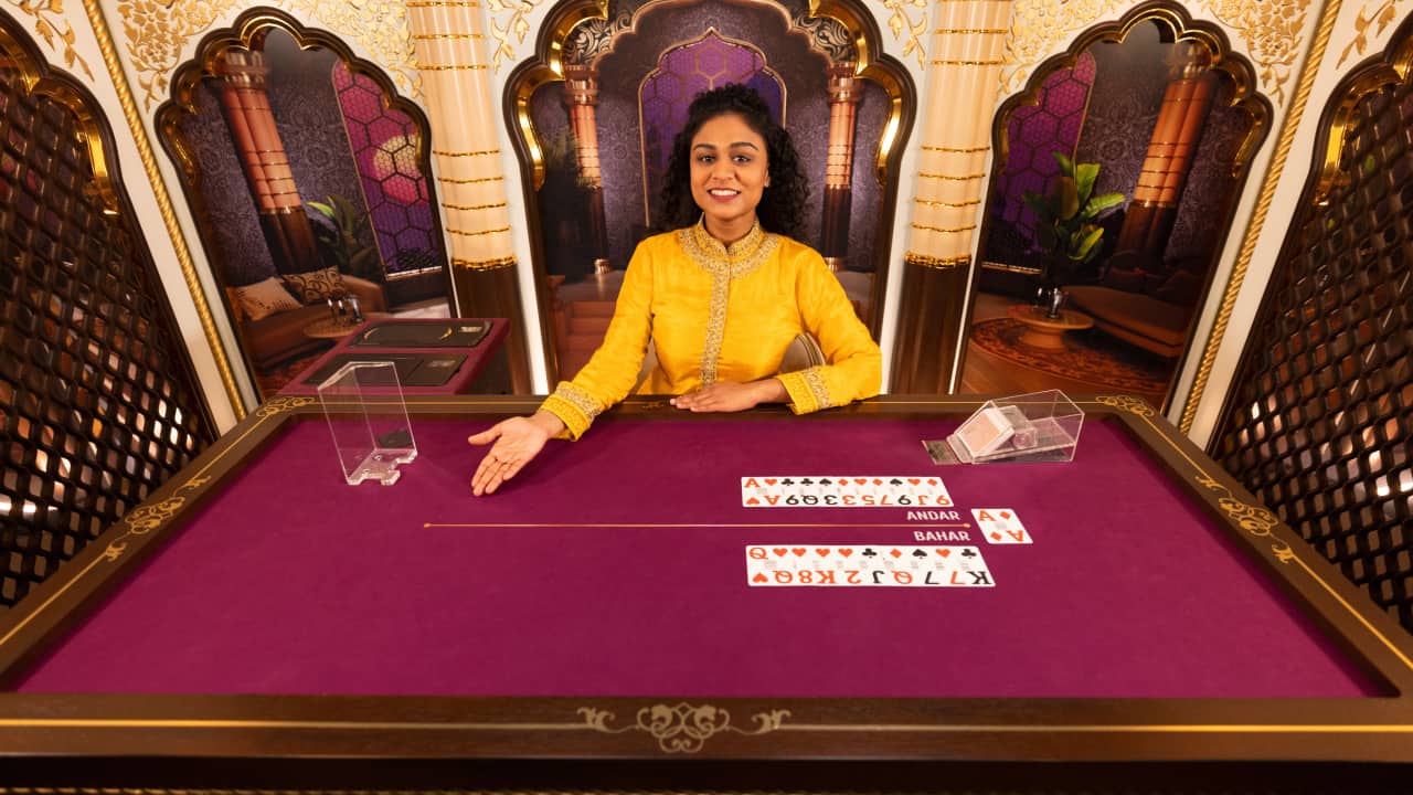 Seuper Andar Bahar live casino presenter smiling and dealing cards